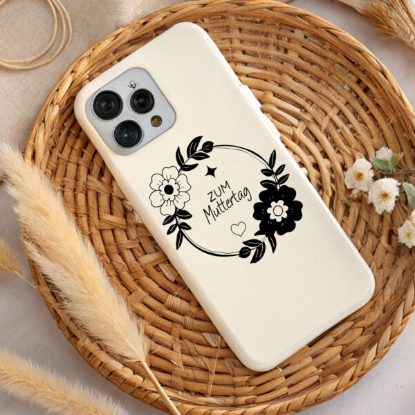 Cream phone case with black floral wreath design. "Zum Muttertag" (Mother's Day) text. Perfect Mother's Day gift. SVG, PNG download.