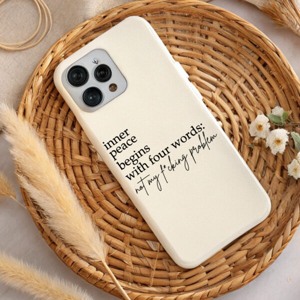 Cream phone case with "Inner peace begins with four words: not my f*cking problem" quote.