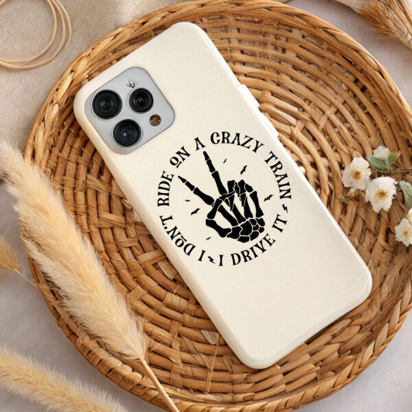 Cream phone case with skeleton hand design. "Ride on a crazy train, I don't drive it" text. Sublimation design. Perfect gift.