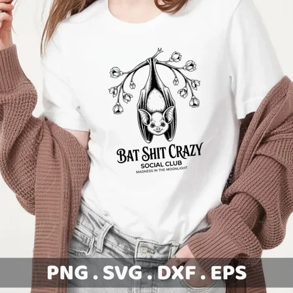 A Halloween-themed t-shirt design featuring a bat hanging upside down from a flowering branch, with the text "Bat Shit Crazy Social Club," intended for Cricut cutting or serigraphy applications.