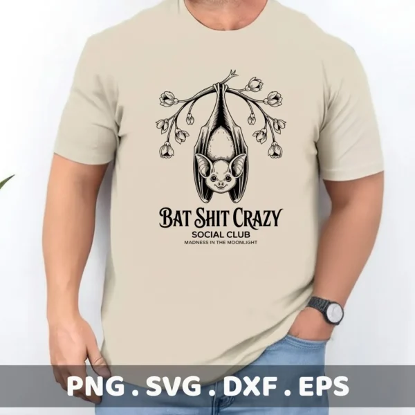 A t-shirt features a Halloween bat Cricut design of a bat hanging upside down from a flowering branch, intended for cutting and serigraphy applications.