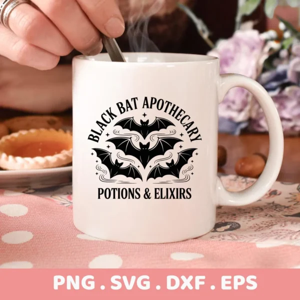 Close-up of a white mug featuring a "Black Bat Apothecary" design with stylized bats, intended for Cricut cutting and serigraphy applications.