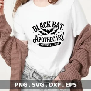 A white t-shirt displays a "Black Bat Apothecary" Cricut design, suggesting its use for cutting and serigraphy projects related to Halloween and spooky themes.