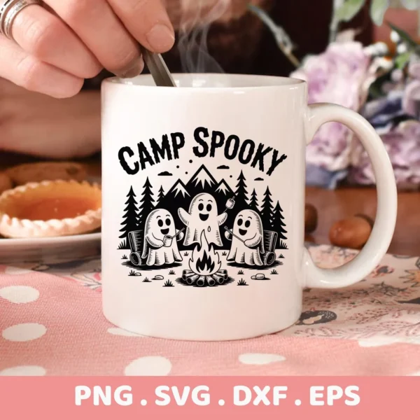 Close-up of a white mug featuring a "Camp Spooky" ghost SVG file design, showing cartoon ghosts camping around a campfire, intended for cutting machines like Cricut or serigraphy applications.
