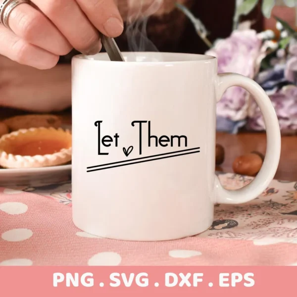 Let Them" Cricut design on a coffee mug as a vinyl decal.