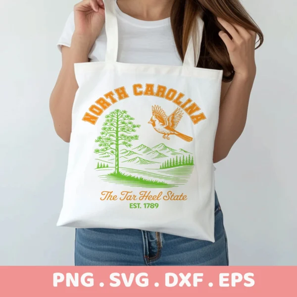 North Carolina Cricut design for a tote bag screen print; Tar Heel state pride SVG with cardinal, pine tree, and mountain silhouette.