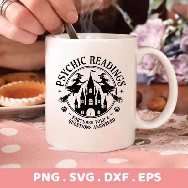 Close-up of a white mug featuring a Halloween Psychic Reading Cricut design with witches, a castle, and the text "Psychic Readings, Fortunes Told & Questions Answered," suitable for cutting or serigraphy applications.