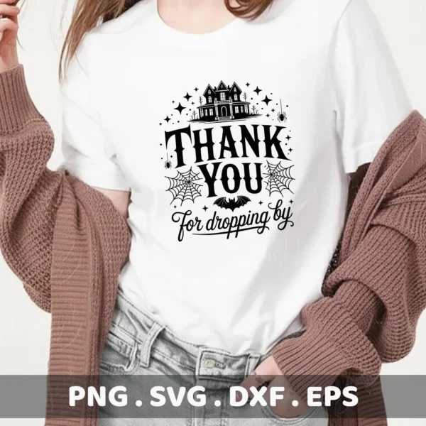 A white t-shirt displays a black Halloween-themed "Thank You For Dropping By" design featuring a spooky house silhouette, spiderwebs, a bat, and stars, suitable for Cricut cutting and serigraphy applications.