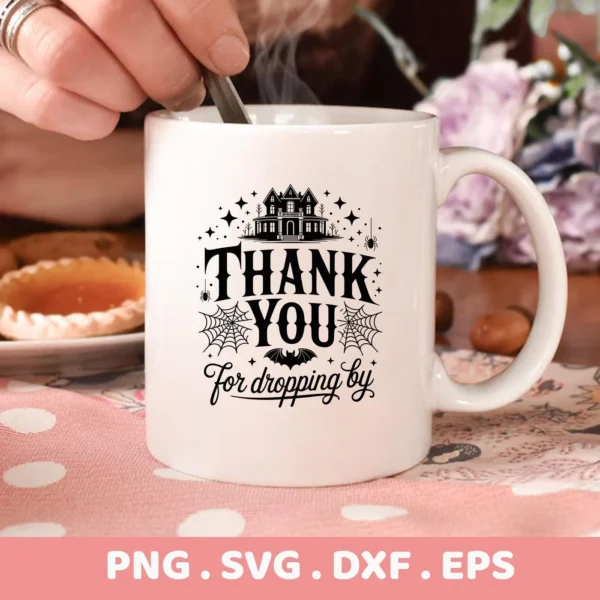 A white mug displays a "Halloween Thank You Cricut" design featuring a spooky house silhouette, spiderwebs, and the phrase "Thank You For Dropping By," intended for cutting and serigraphy applications.