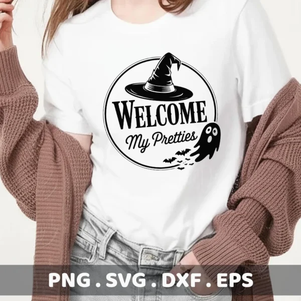 A Halloween Welcome Cricut Design featuring a witch hat, bats, and ghost, intended for cutting or serigraphy applications, displayed on a white t-shirt.
