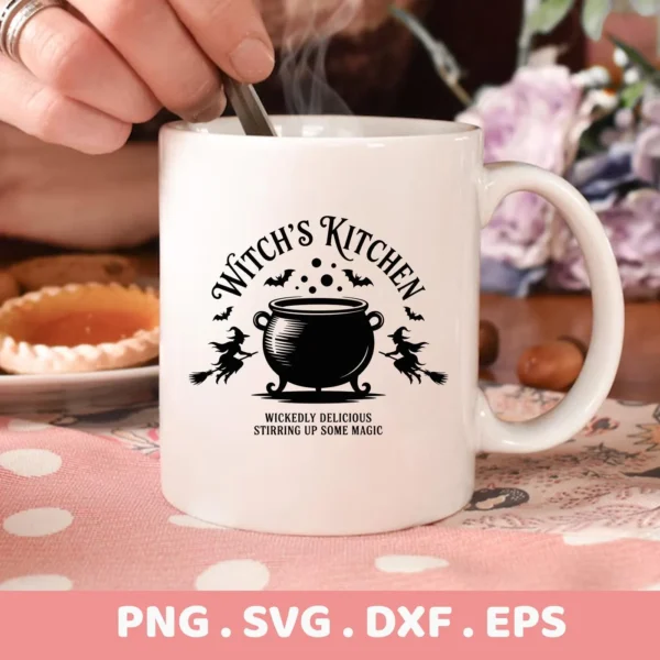 Close-up of a white mug featuring a "Witch's Kitchen Cricut Design" with a cauldron, bats, and witches, intended for cutting machines or screen printing.