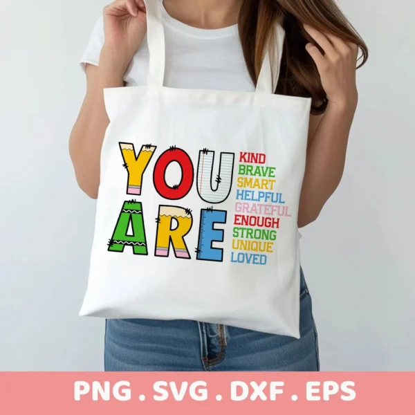 You Are SVG" positive affirmation design for Cricut vinyl cutting on a tote bag.