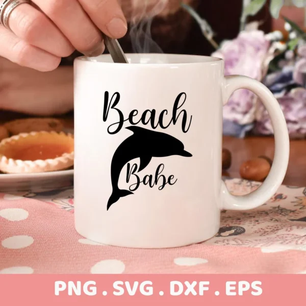 White mug with a black silhouette of a dolphin and the words "Beach Babe" above and below it, representing a Dolphin Beach Babe SVG Cricut digital download bundle.