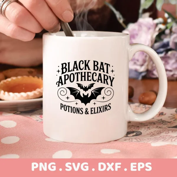 Close-up of a white mug featuring a "Black Bat Apothecary" design with a bat silhouette, intended for Halloween-themed cutting projects using Cricut or similar machines.