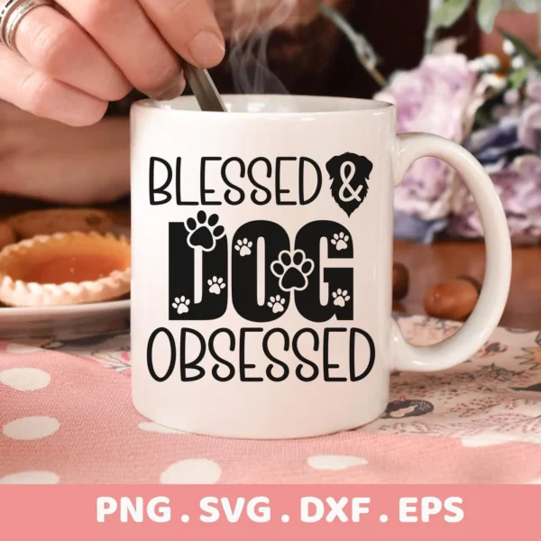 Close-up of a white mug with the text "Blessed & Dog Obsessed" incorporating paw prints and a dog silhouette, representing a Blessed Dog Obsessed SVG digital download bundle (SVG, PNG).