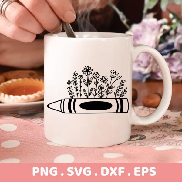 A white mug displays a "Crayon Flowers SVG Design," featuring a crayon graphic with floral elements sprouting from it; this is a digital download bundle including SVG and PNG files.