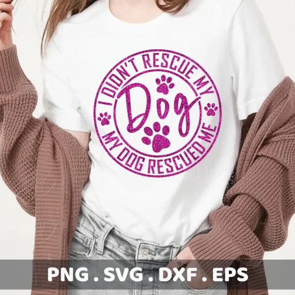 A woman wearing a white t-shirt with a pink glittery "I Didn't Rescue My Dog, My Dog Rescued Me" design featuring paw prints, showcasing a Rescue Dog SVG Cricut Design digital download bundle (SVG, PNG, DXF, EPS).
