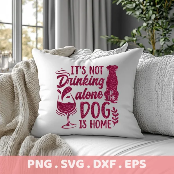 A white throw pillow with a glittery pink design that reads "It's not drinking alone if the dog is home" with a wine glass and dog silhouette, showcased as a digital download bundle (SVG, PNG, DXF, EPS).