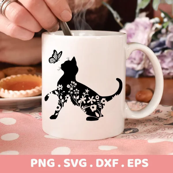 Close-up of a white mug featuring a black Floral Cat Silhouette SVG design with a butterfly, indicating a digital download bundle (SVG, PNG).