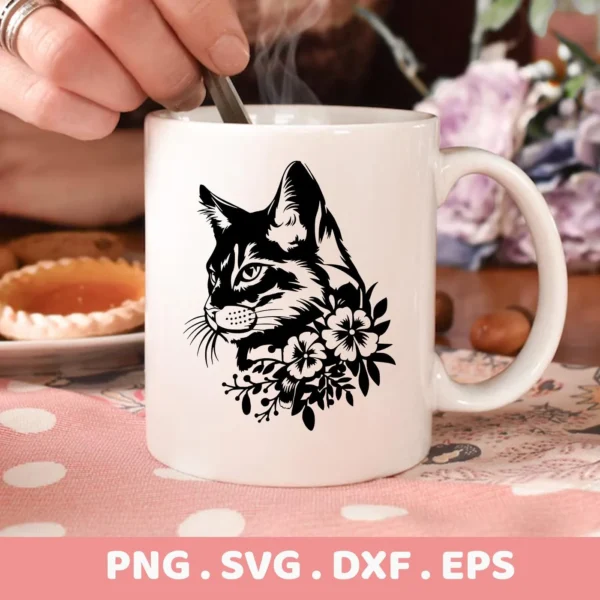 Close-up of a white mug featuring a black silhouette of a cat's head adorned with floral elements, representing a Floral Cat SVG Cricut digital download bundle (SVG, PNG).