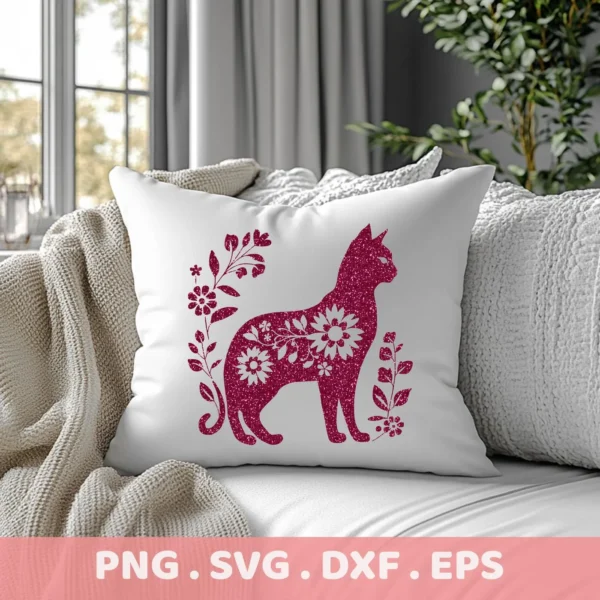 Close-up of a white pillow on a couch, featuring a floral cat silhouette SVG design in glittery pink, surrounded by floral elements; digital download bundle (SVG, PNG).