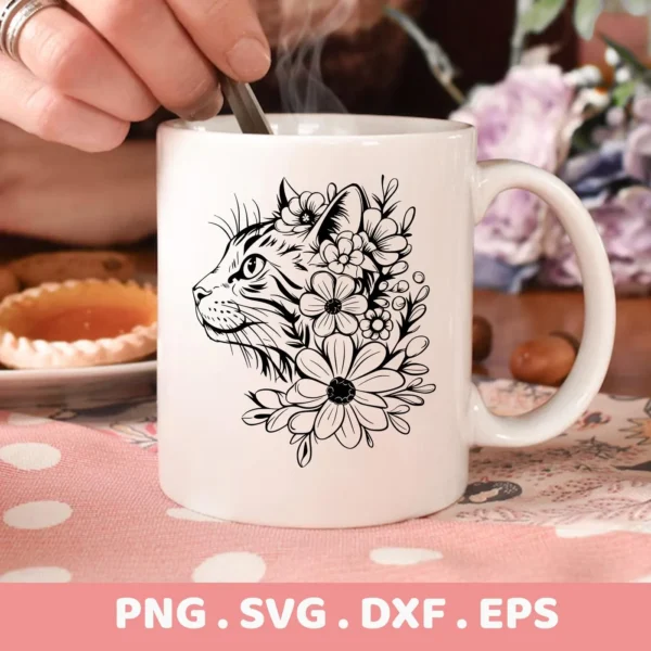 A white mug displays a Floral Cat Silhouette SVG File design, showing a cat's head in profile adorned with flowers; this is a digital download bundle including SVG and PNG formats.
