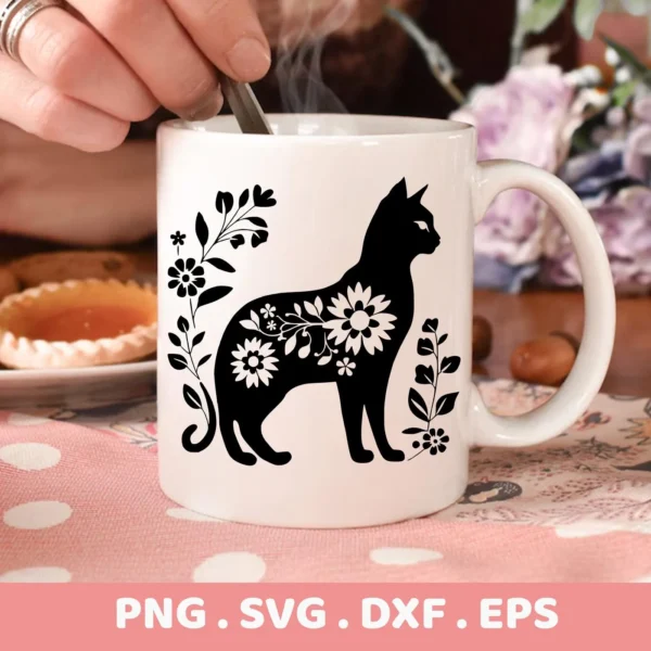 A white mug displays a black Floral Cat Silhouette SVG design, part of a digital download bundle including PNG, DXF, and EPS formats.