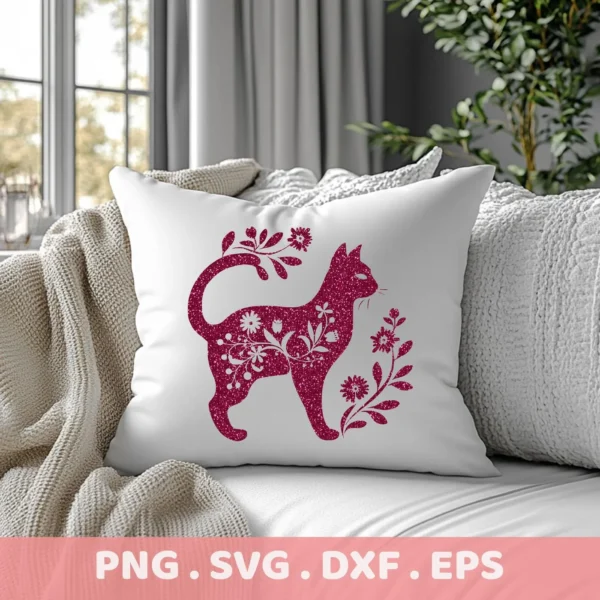 A white throw pillow on a couch displays a floral cat silhouette SVG design in a sparkly maroon color, representing a digital download bundle.