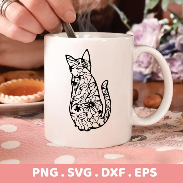 Close-up of a white mug featuring a black floral cat SVG Cricut design, part of a digital download bundle including SVG and PNG formats.