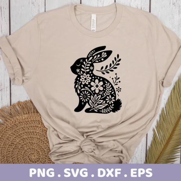 A beige t-shirt displays a black, floral-filled rabbit silhouette, representing a Floral Rabbit SVG Cricut Design digital download bundle (SVG, PNG).