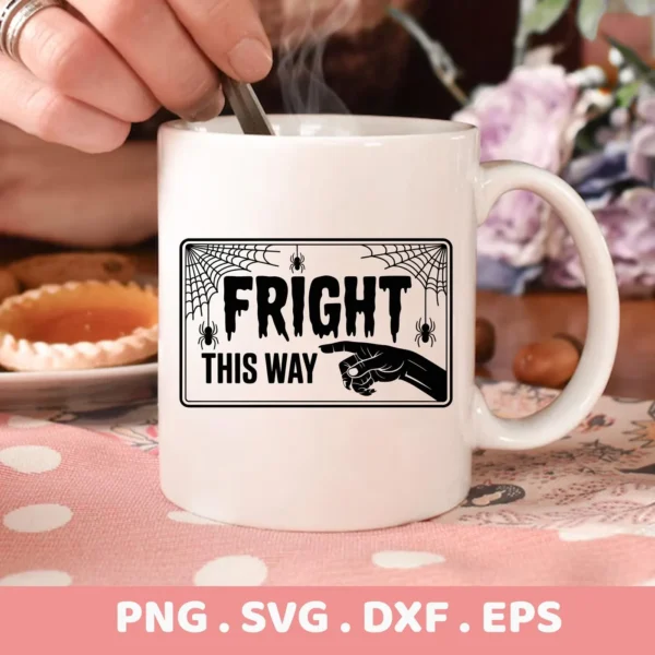 Close-up of a white mug featuring a "Fright This Way" design with spiderwebs and a pointing hand, ideal for Halloween-themed Cricut projects.