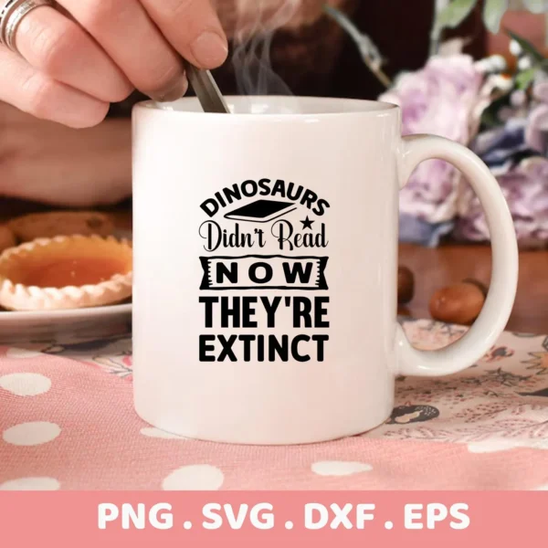 A white mug with the text "Dinosaurs Didn't Read Now They're Extinct" and a graduation cap above the word "Dinosaurs", available as a digital download bundle (SVG, PNG, DXF, EPS) for crafts.