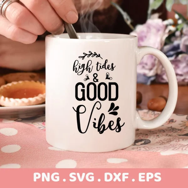 Close-up of a white mug with the "High Tides & Good Vibes" SVG design in black lettering, steam rising from the mug, a hand stirring with a spoon, and a plate of pastries nearby, representing a digital download bundle (SVG, PNG, DXF, EPS).