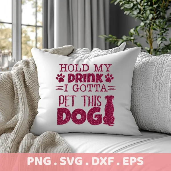 Close-up of a white throw pillow on a couch, featuring a glittery pink design that reads "Hold My Drink I Gotta Pet This Dog" with paw prints and a dog silhouette; a digital download bundle (SVG, PNG).