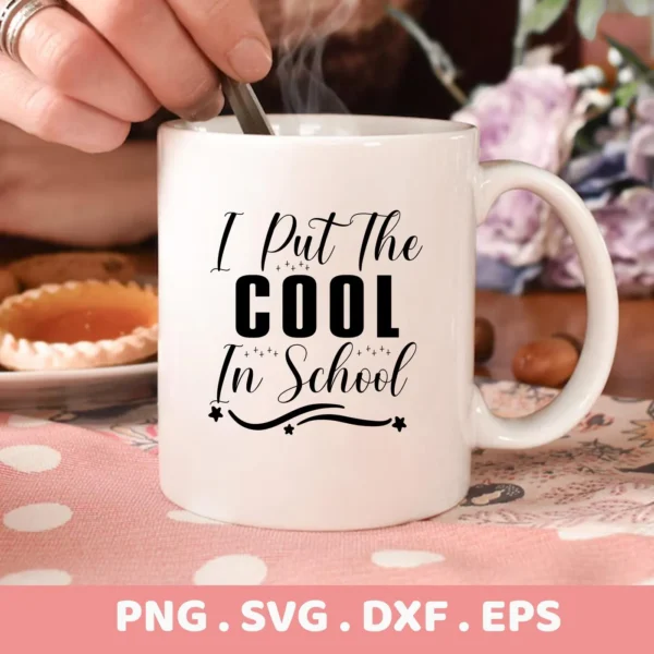 Close-up of a white mug with the text "I Put The Cool In School," showcasing a Cool School SVG design available as a digital download bundle (SVG, PNG, DXF, EPS).