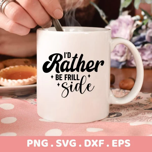 Close-up of a white mug with the text "I'd Rather Be Frill Side" in black lettering, showcasing the Frill Side SVG design, part of a digital download bundle including SVG and PNG formats.
