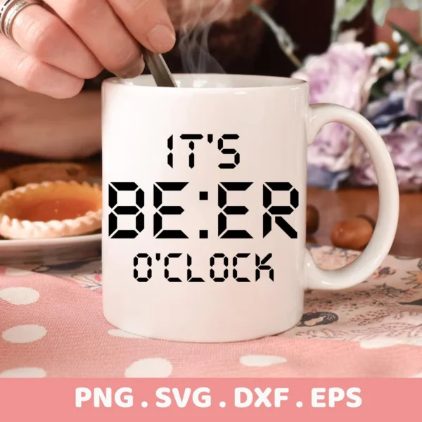 Close-up of a white mug with the phrase "It's BE:ER O'Clock" in a digital clock font, representing the "It's Beer O'Clock SVG" design, part of a digital download bundle including SVG and PNG formats.