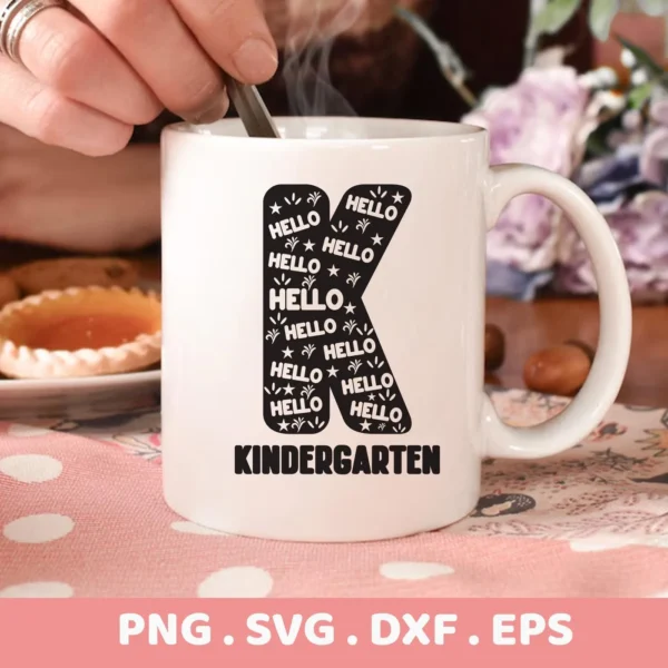 Close-up of a white mug with a "Kindergarten Letter K SVG" design filled with the word "Hello," part of a digital download bundle (SVG, PNG, DXF, EPS).