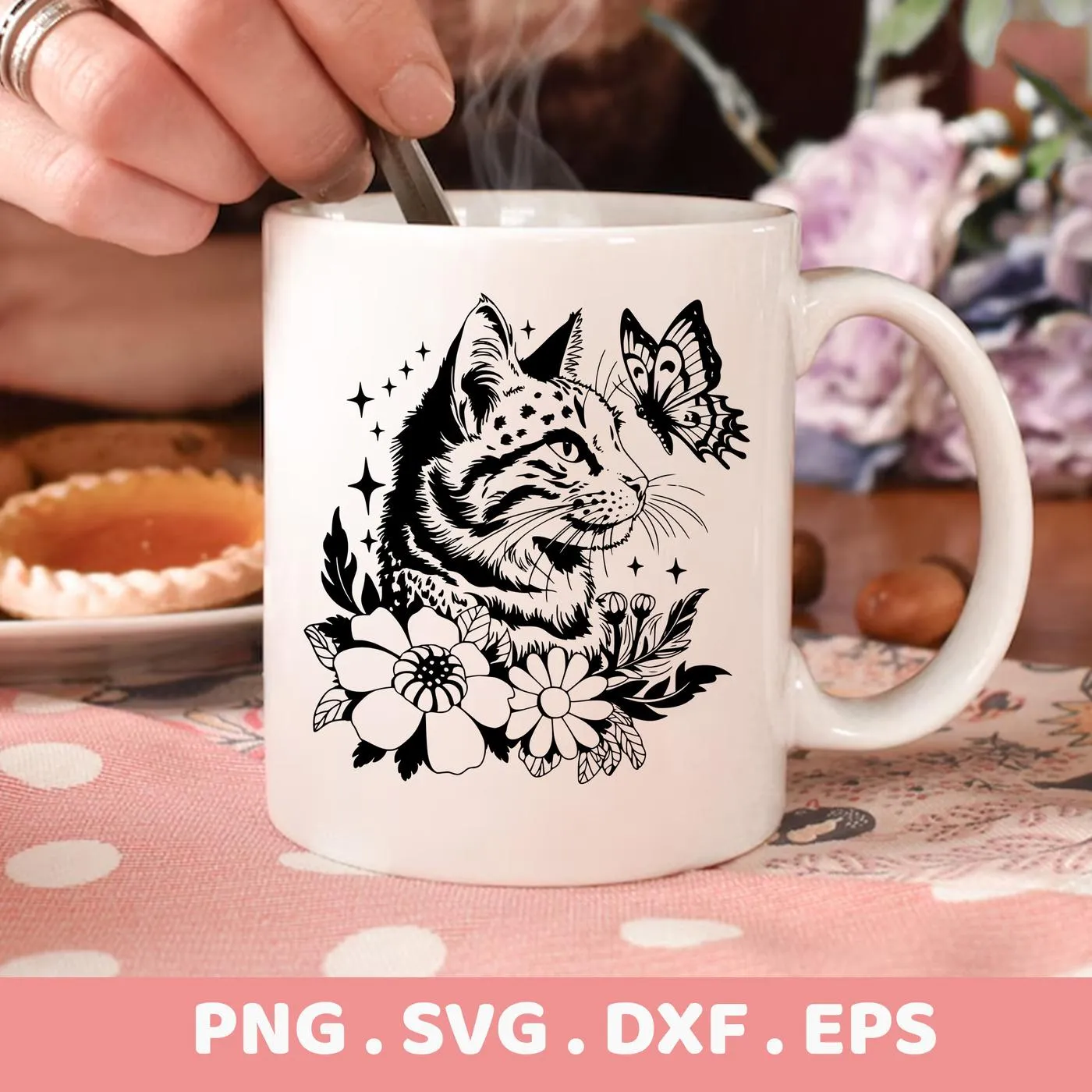 Close-up of a white mug featuring a black and white floral cat SVG design with a butterfly, indicating a digital download bundle (SVG, PNG, DXF, EPS).