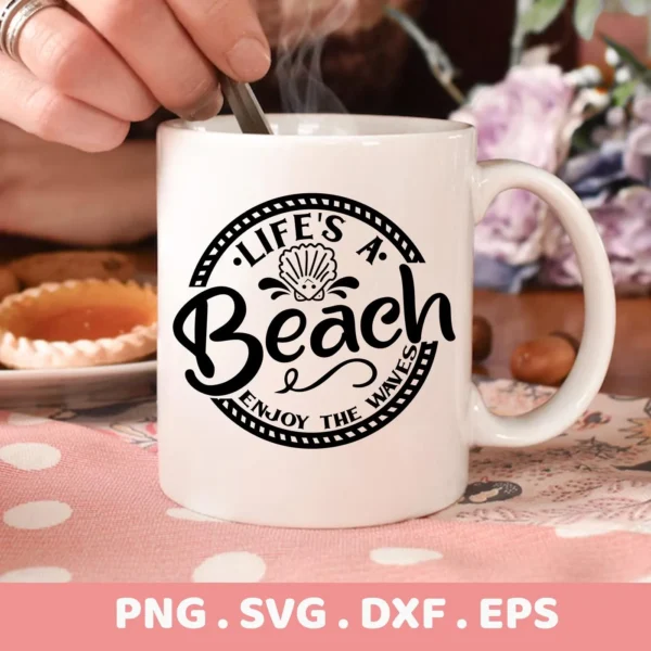 Close-up of a white mug featuring the design "Life's a Beach" with a seashell graphic, part of a digital download bundle including SVG and PNG files.