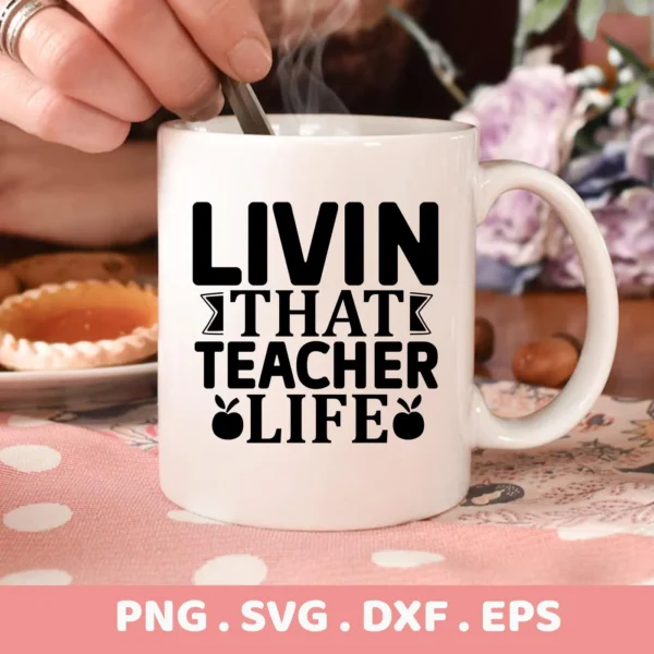 Close-up of a white mug with the text "LIVIN THAT TEACHER LIFE" and apple graphics, representing a Teacher Life Apple SVG design available as a digital download bundle (SVG, PNG, DXF, EPS).