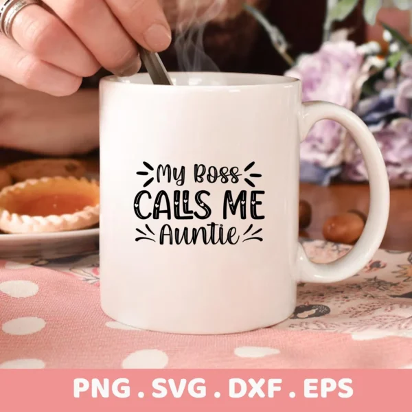 Close-up of a white mug with the text "My Boss Calls Me Auntie" in black lettering, part of an Auntie SVG Mother's Day digital download bundle.