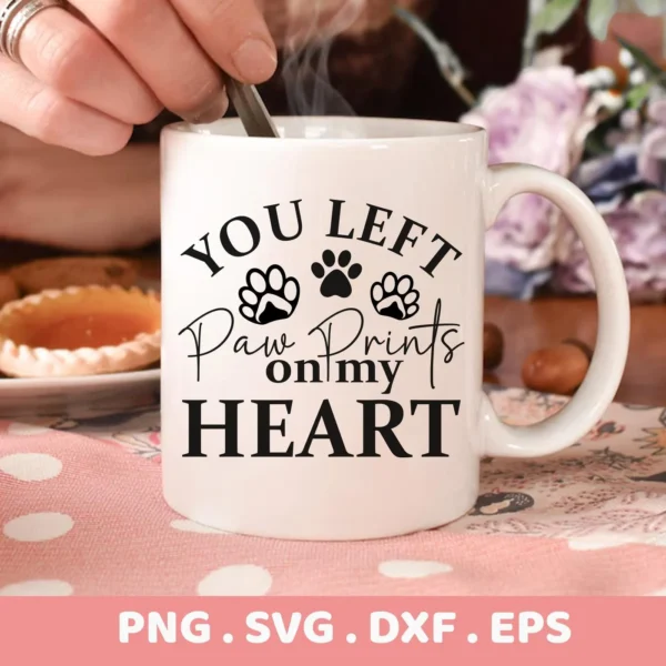 A white mug with the text "You Left Paw Prints on my Heart" and paw print graphics, presented as a Paw Prints Heart SVG digital download bundle (SVG, PNG).
