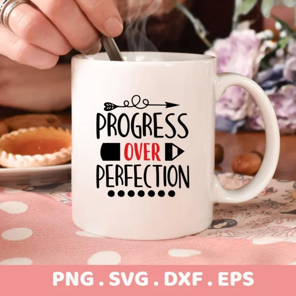 Close-up of a white mug with the quote "Progress Over Perfection" in a decorative font, representing a digital download bundle (SVG, PNG).