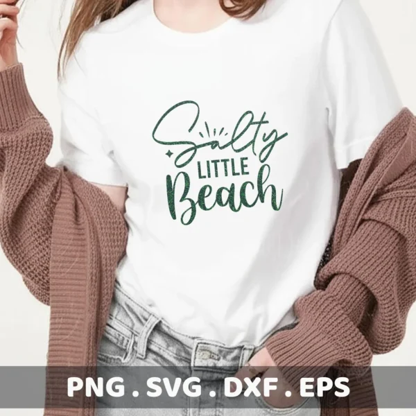 A woman wearing a white t-shirt with the text "Salty Little Beach" in a stylized green font, showcasing a Salty Little Beach SVG digital download bundle.