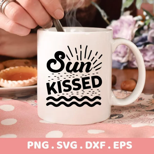 Close-up of a white mug featuring a "Sun Kissed" SVG design with sun rays, dashes, and wave graphics, presented as a digital download bundle (SVG, PNG).