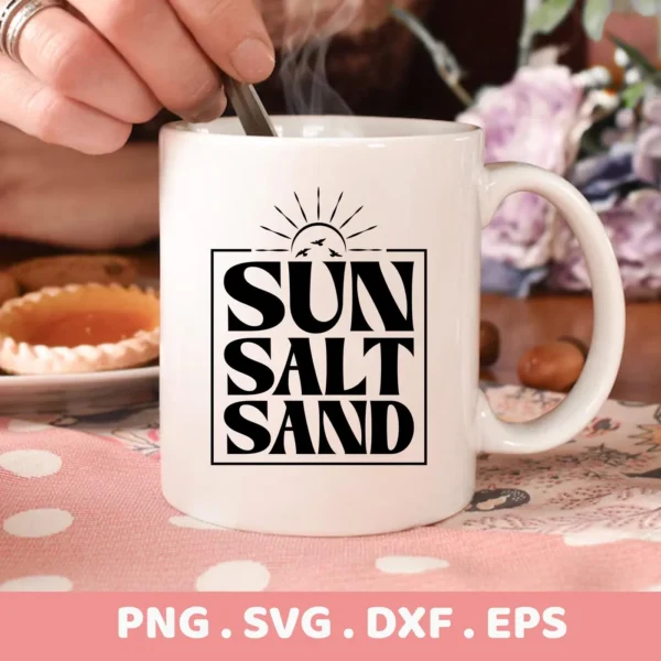 A white mug with the words "Sun Salt Sand" stacked in a black square, with a sun and birds above, representing a digital download bundle (SVG, PNG).