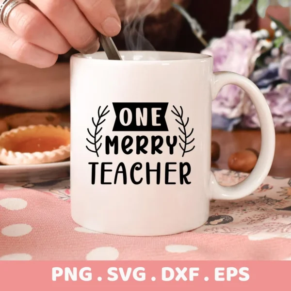 White mug with "One Merry Teacher" design, part of Merry Teacher SVG digital download for Cricut and Silhouette projects.
