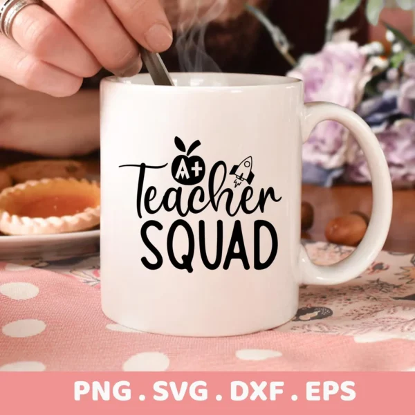 Close-up of a white mug featuring the "Teacher Squad" SVG Design with an apple and rocket graphic, part of a digital download bundle (SVG, PNG, DXF, EPS).