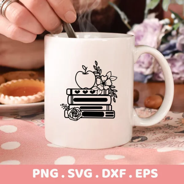 A white mug displays the "Floral Books Apple SVG" design, featuring an apple atop stacked books adorned with floral elements; available as a digital download bundle (SVG, PNG, DXF, EPS) for crafting.